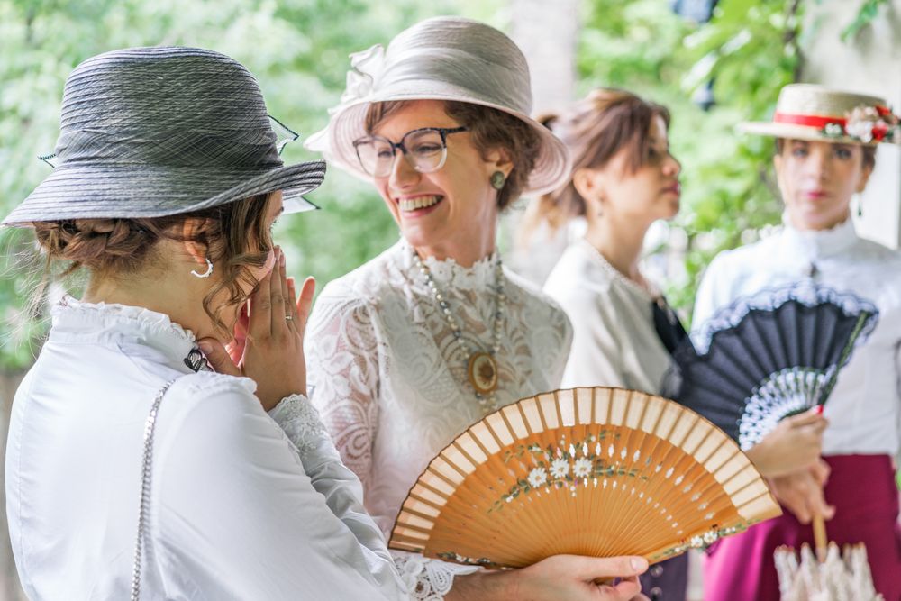 Vintage female friends speaking in garden