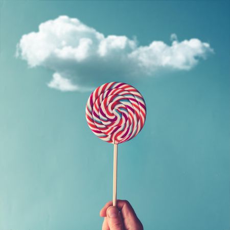 Lollipop on sky background