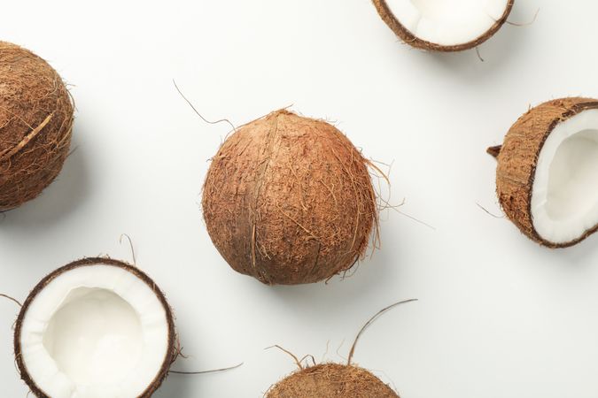 Flat lay with coconut on plain background, top view