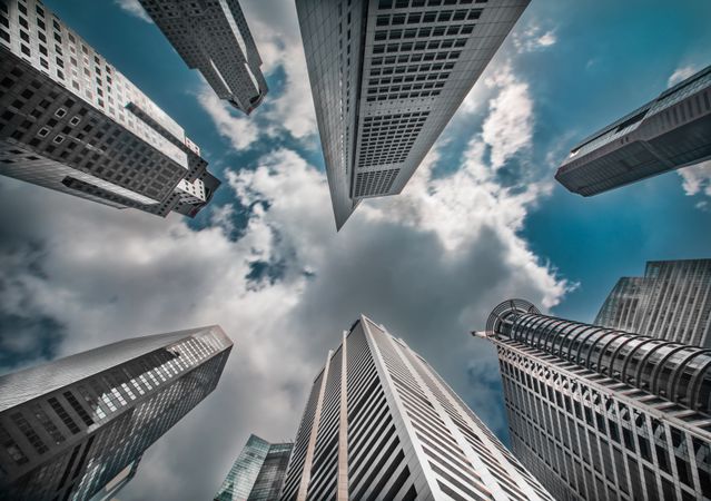 Low-angle view of skyscraper under blue sky