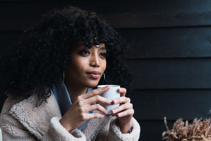 Black woman with cup of coffee
