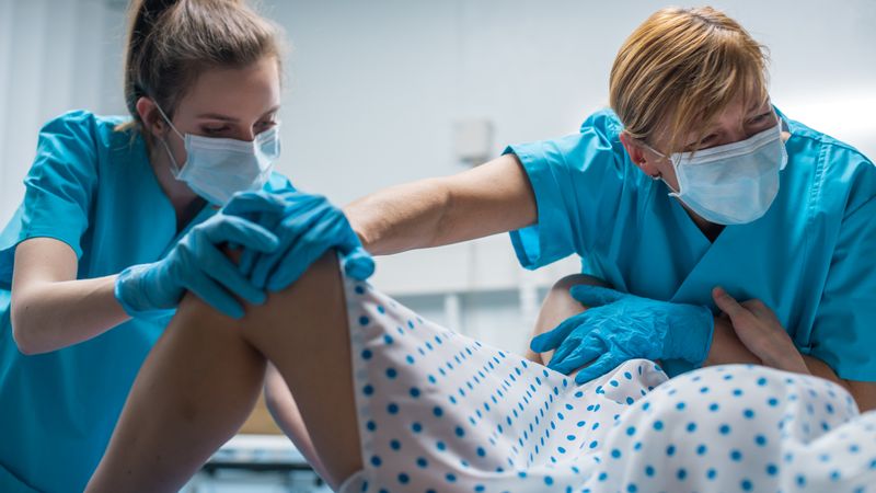 In the Hospital Woman in Labor Pushes to Give Birth