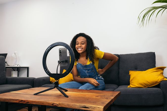 Young woman vlogging for social media