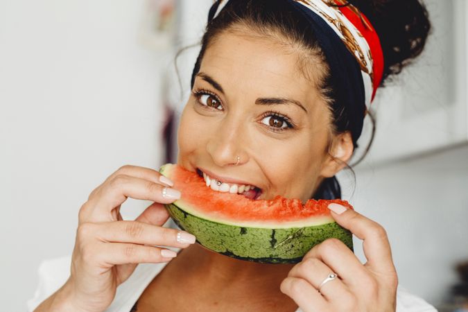 Pregnant female eating delicious watermelon