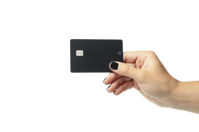 Female hand hold dark card, isolated on blank background