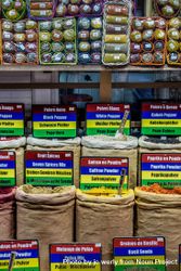 Large bags of spices labeled in different languages 56E9e0
