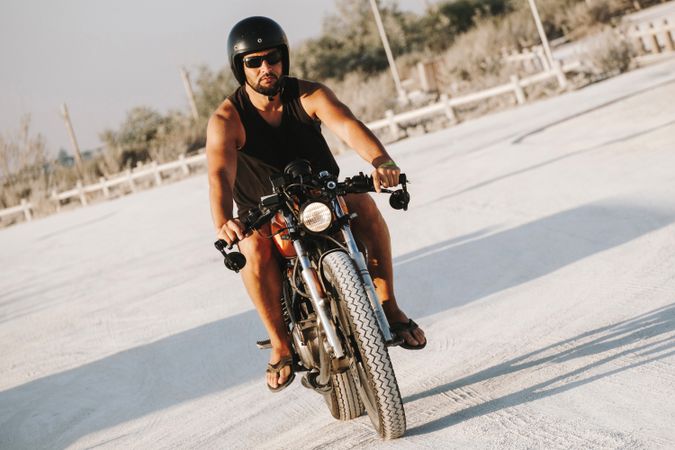 Confident male driving motorcycle