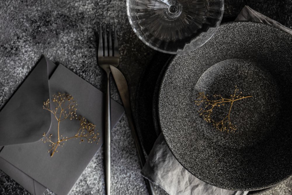 Table setting with delicate dried flower and envelope