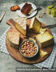 Flat-lay of cheese spread on wood board 4BLme0