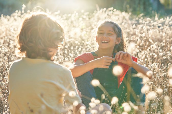 Smiling girl looking at friend in countryside