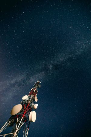 Communication tower and sky with stars in evening