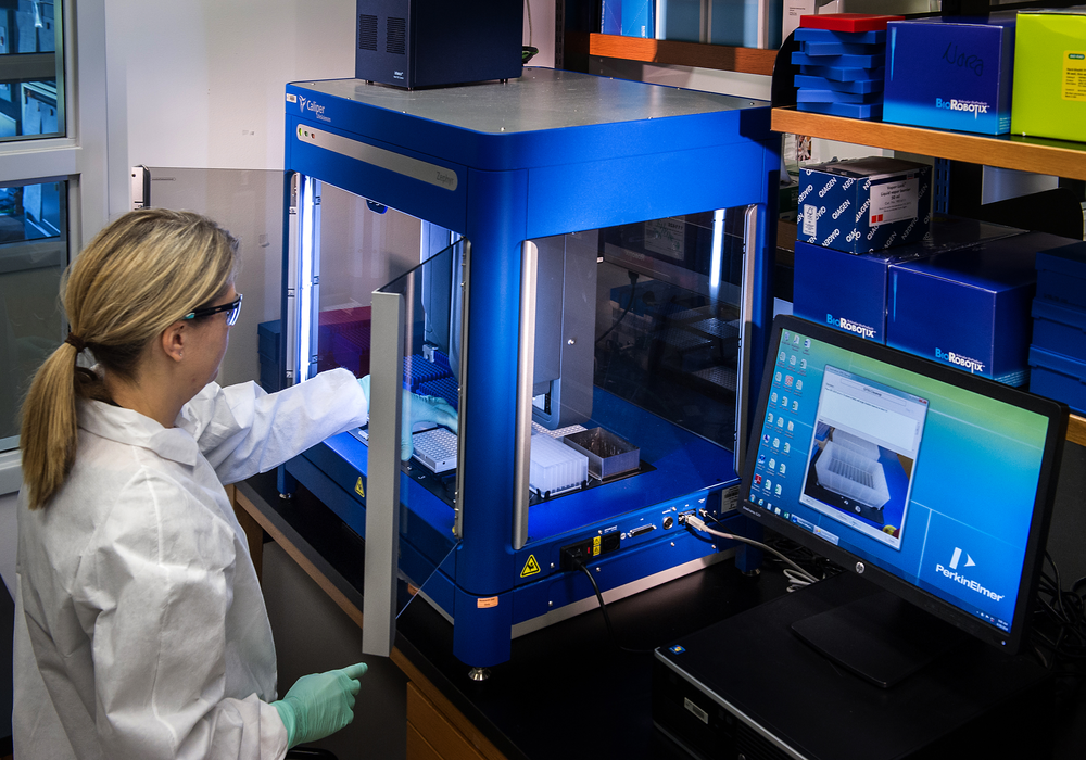 Scientist working at Caliper LifeSciences’ Zephyr Molecular Biology Workstation