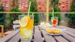 Snacks and drinks on empty table outside