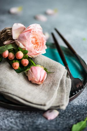 Delicate pink flowers on grey napkin