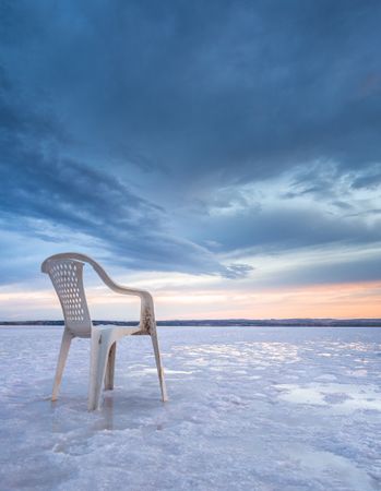 Chair on salt mine during sunset