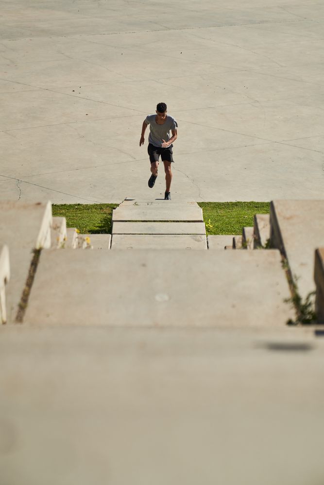 Fast man running on stones