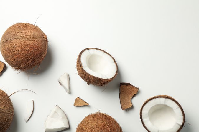 Flat lay with coconut on plain background, top view