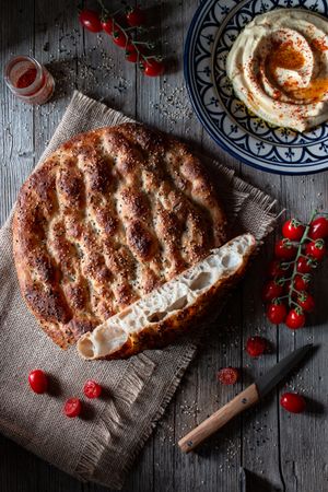 Ramazan pidesi near spices and tomatoes