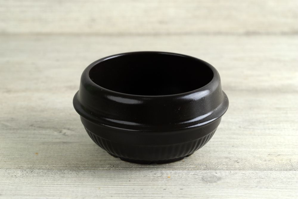 Korean Clay Pot Ttukbaegi on White Wooden Table