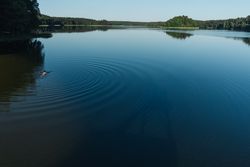 View of calm large lake and tourist
