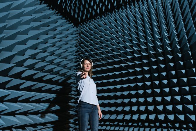 Woman in sound room listening to music