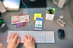 Woman booking trip from home looking at covid health passport