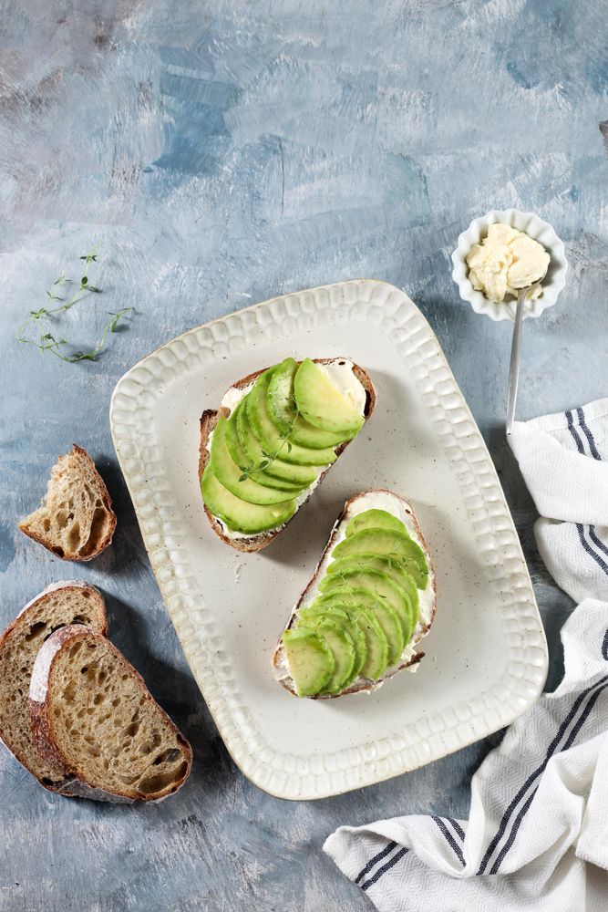 Open Sandwich Sourdough Bread with Sliced Avocado, Cream Cheese, and Honey