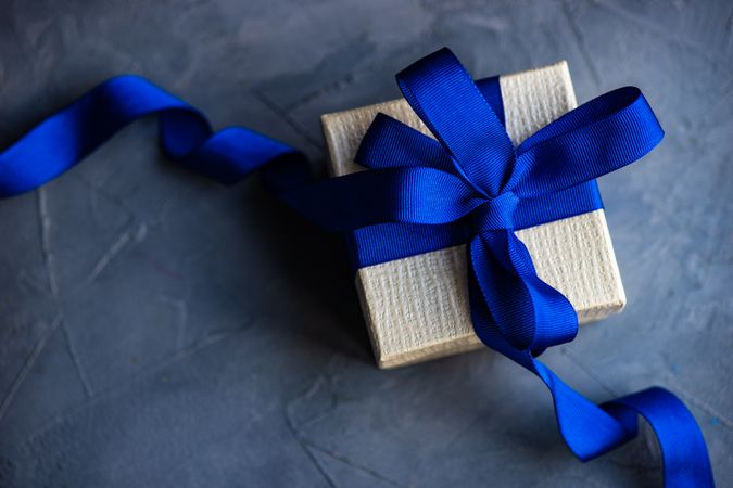 Gift box concept with blue ribbon