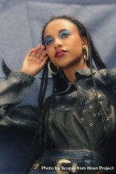 Woman in leather jacket and blue eye shadow 5Rzw15