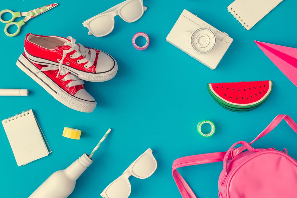 Back to school supplies on bright blue background