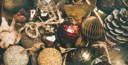 Rustic holiday tree decorations, pine cones, balls and baubles, wide composition