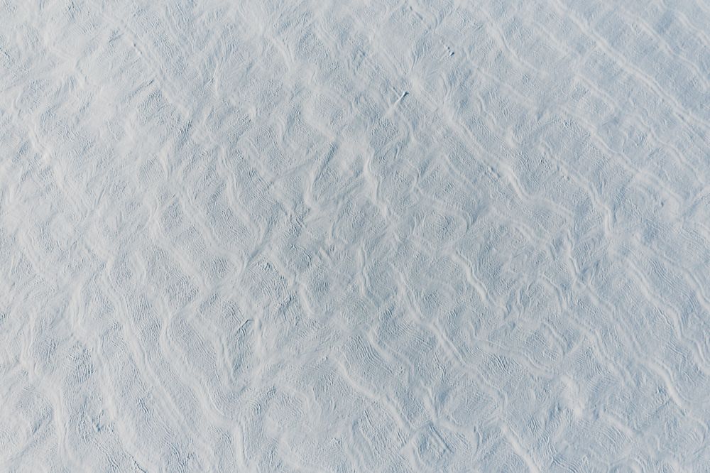 Snow-covered white fields in Alsace, top view.