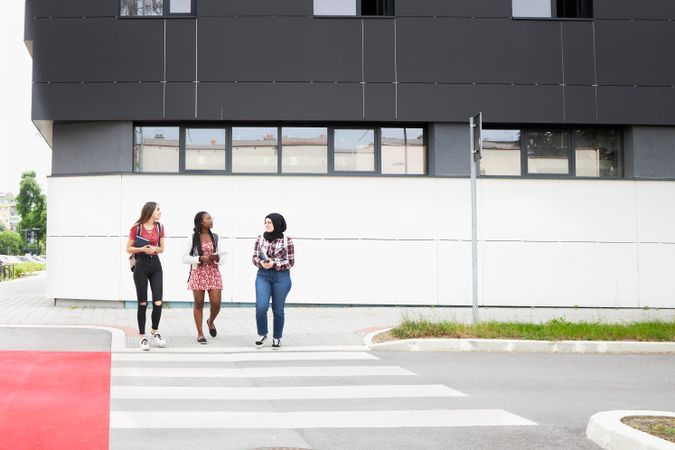 Students at a crosswalk on campus