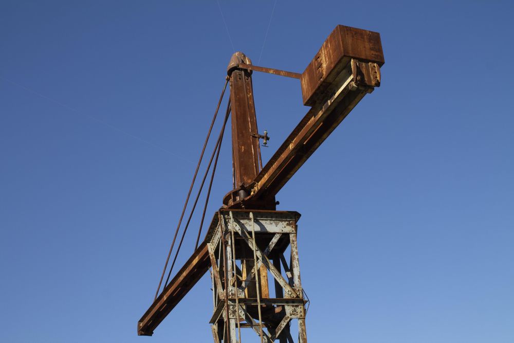 Top view crane on blue sky