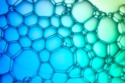 Abstract background bio technology, macro photography foam and water with gradient background. Molecule multicolor backgorund