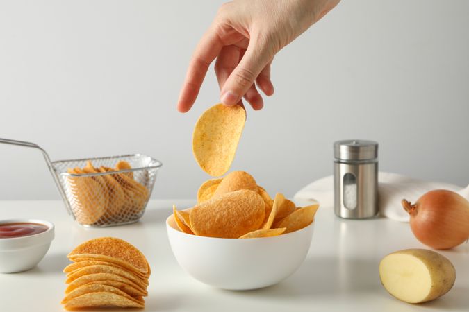 Potato chips in a bowl on a table