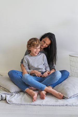 Mother and son having fun together at home
