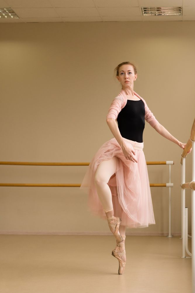 Ballet dancer performing graceful pose en pointe