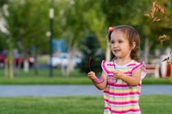 Toddler enjoying summer park outdoors