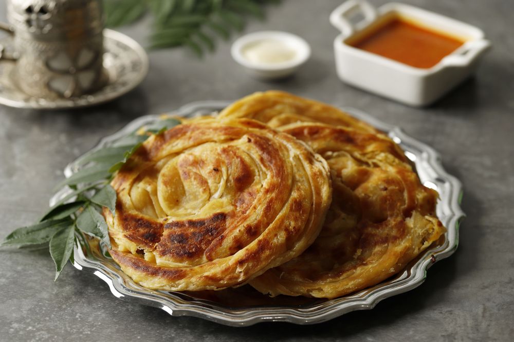 Roti Canai or Paratha with Chicken Curry