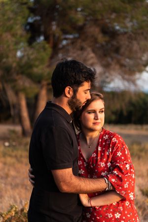 Young happy couple embracing in beautiful garden