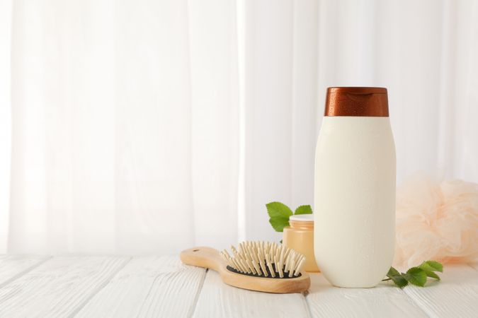 Composition with body care products on wood table
