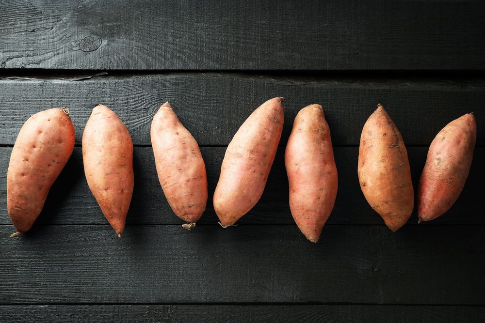 Concept of vegetables, sweet potato, top view