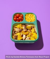Lunch box with summer salad on a purple background 5rmQp0