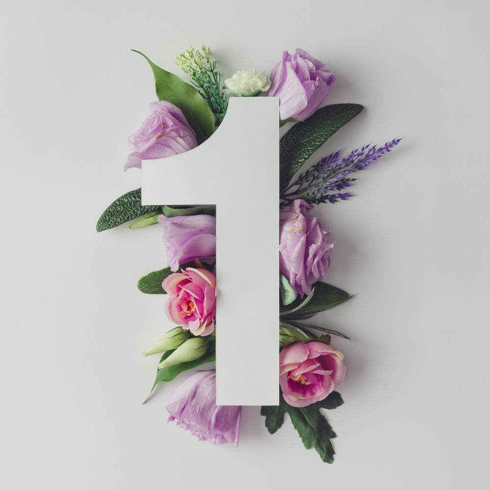 Colorful flowers, leaves and paper “1”