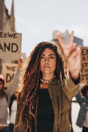 Woman leading a protest on road
