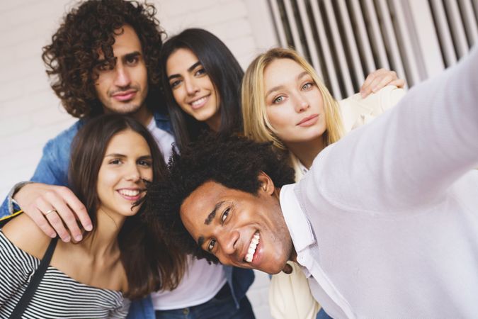 Friends having fun taking a selfie outside