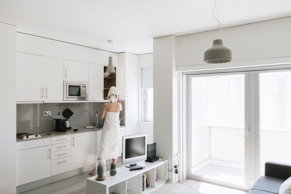 Woman taking from top on kitchen