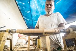 Man using woodworking machine at workplace