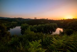 Peaceful river flowing in green nature